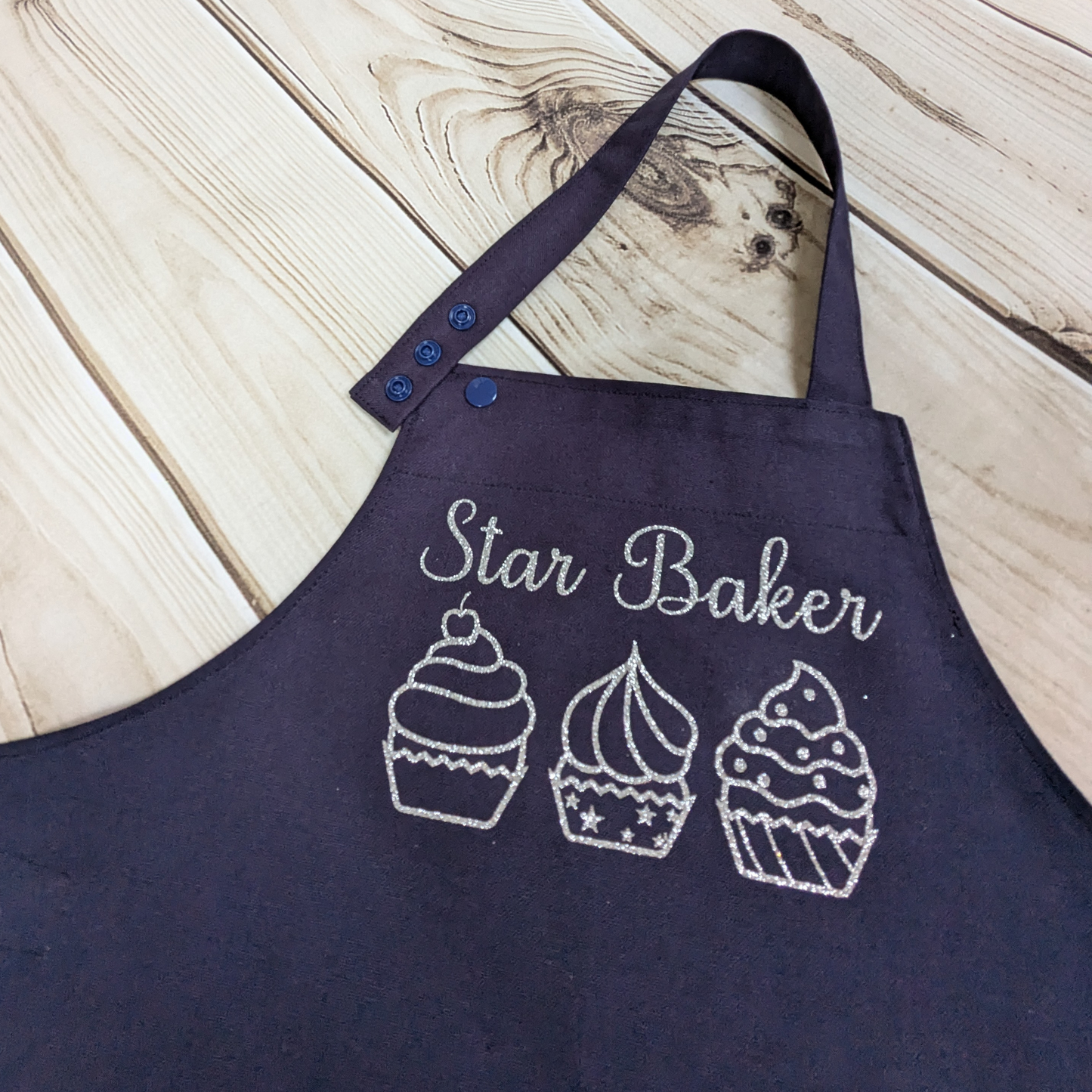 Blue-Handmade-Kids-apron-star-baker-row-of-cupcakes-silver-sparkly-words