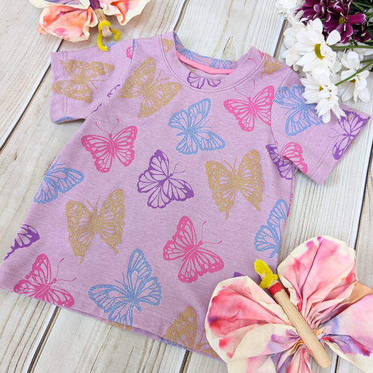 flatlay-glitter-gold-glitter-blue-pink-purple-butterflies-lilac-background-t-shirt