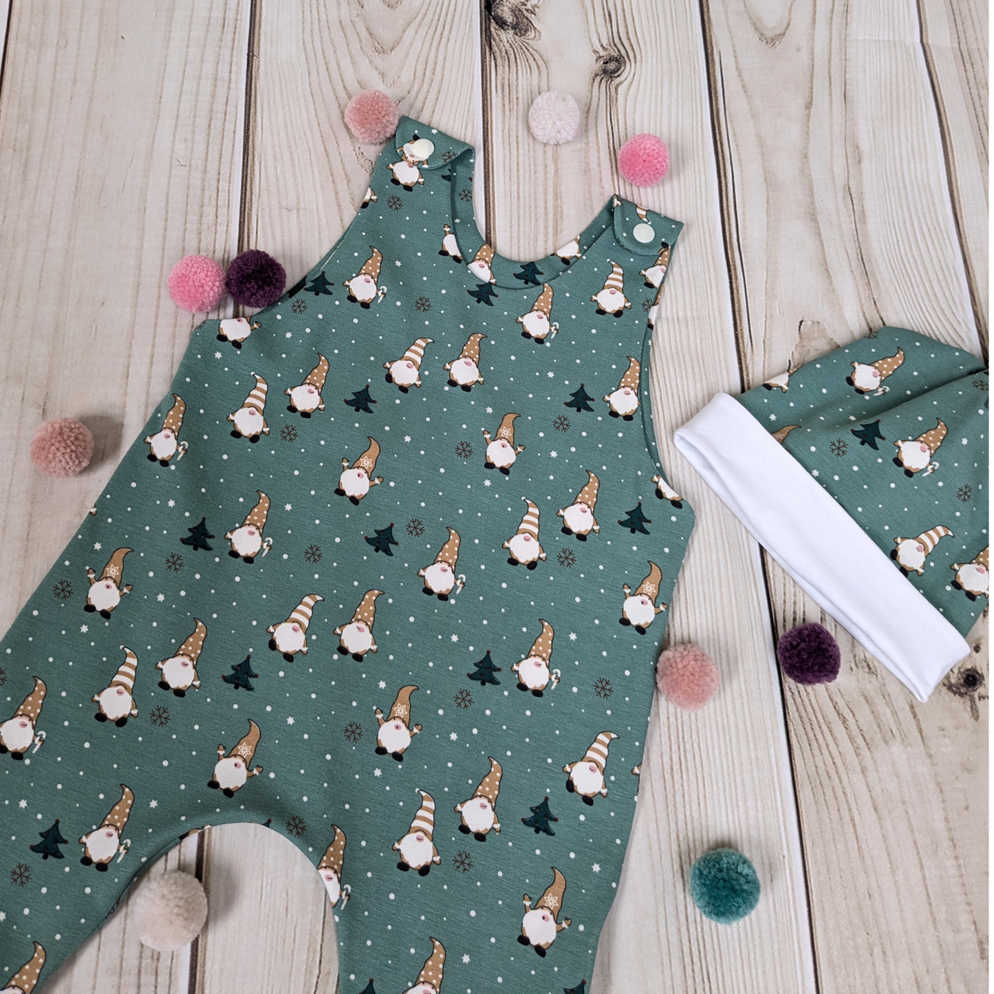 Close-up-Flatlay-Green-Christmas-Gonks-Romper-Hat-Gift-Set