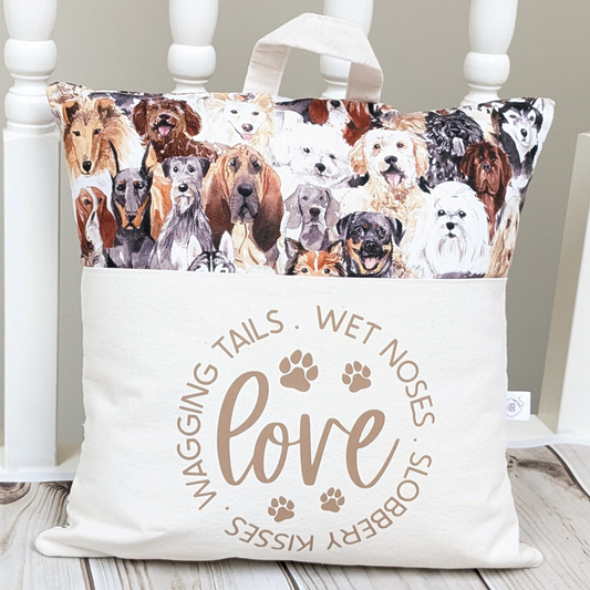 Dog Lover Cushion with pocket. Slogan readsWet Noses, Slobbery Kisses, Wagging Tails.