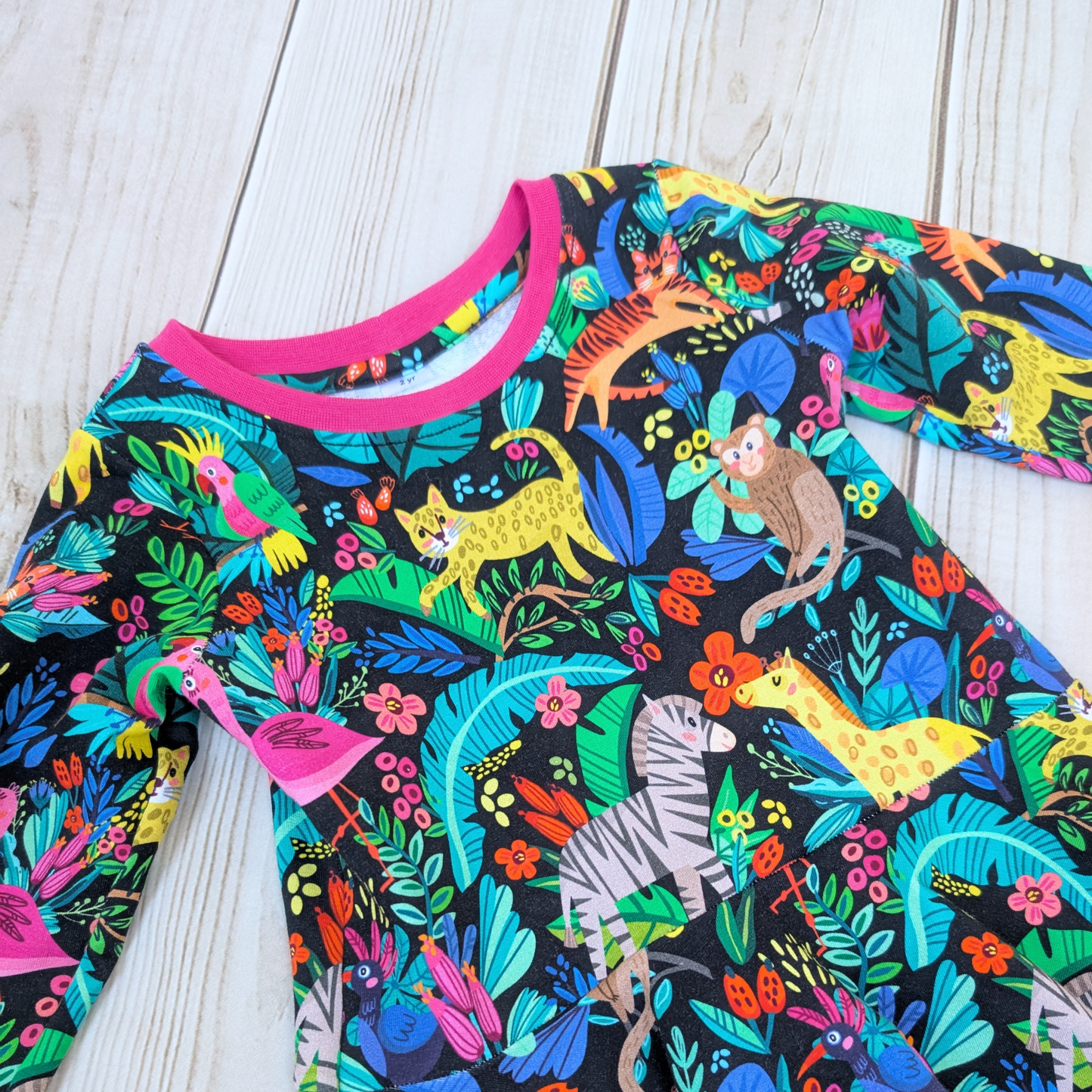 Bright-fun-jungle-flatlay-dress-pink-cuffs-neck