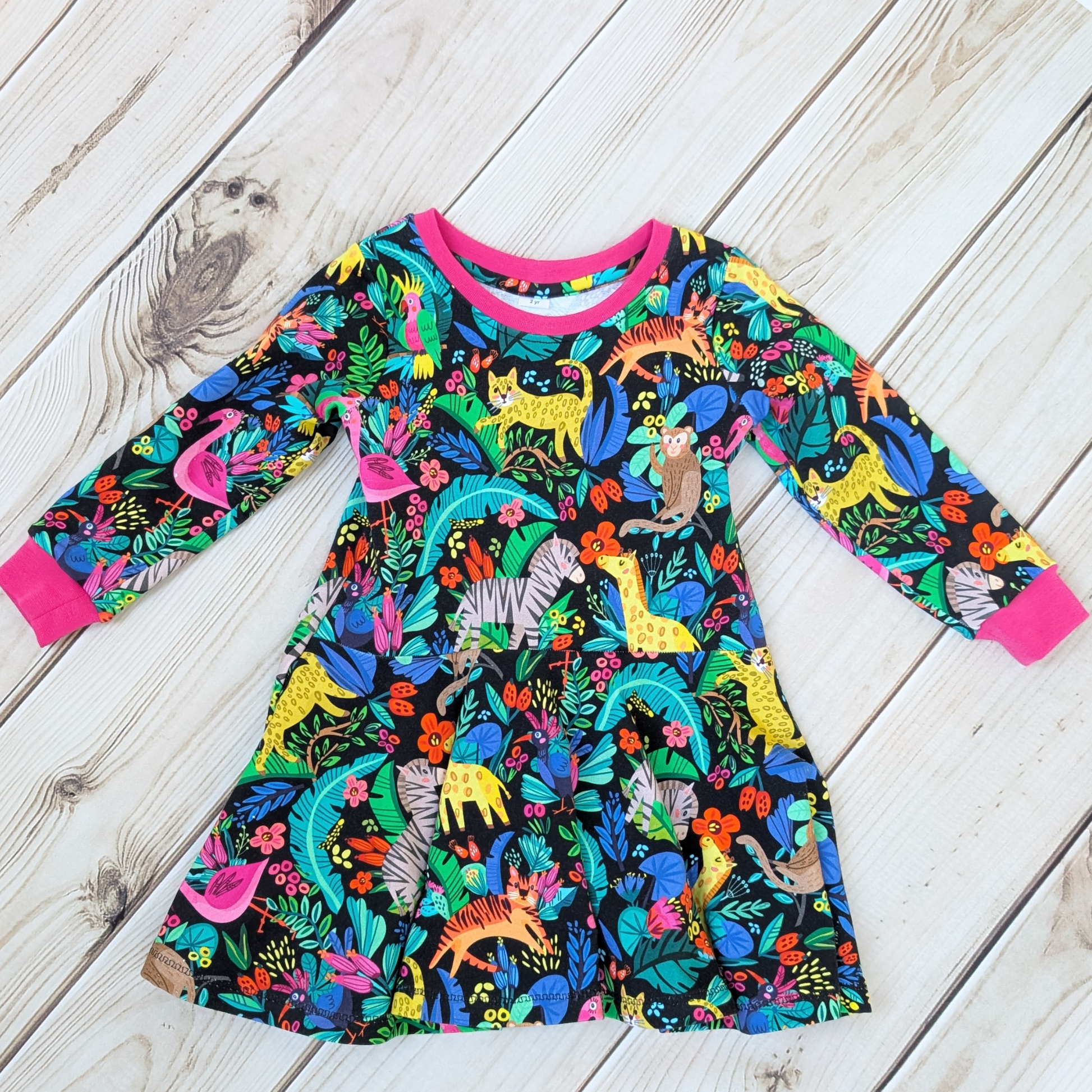 Bright-fun-jungle-flatlay-dress-pink-cuffs-neck