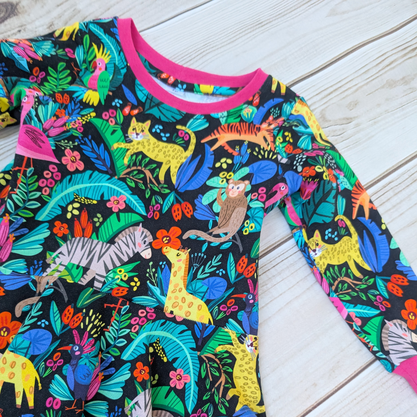 Bright-fun-jungle-flatlay-dress-pink-cuffs-neck