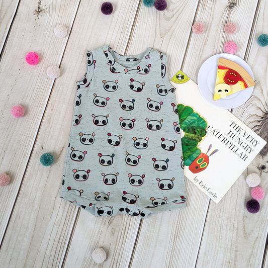 Flatlay-Mint-Panda-Shorts-Romper-with-Snaps-for-Easy-Nappy-Changing-with-book-food-props