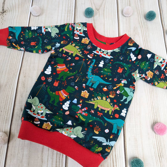 Flatlay-Christmas-dino-jumper-red-cuffs