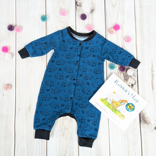 Flatlay-Blue-Elephant-Sleepsuit-with-book-for-decoration