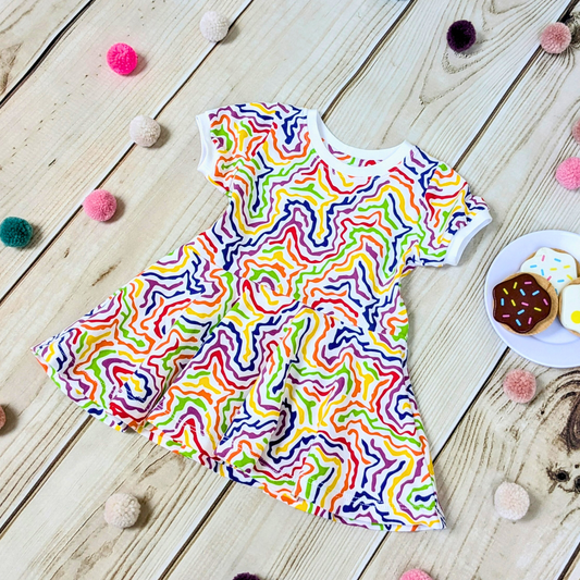 Flatlay-Multi-Coloured-Squiggle-Patterned-fit-n-flare-dress-with-pom-poms-pretend-food-for-props