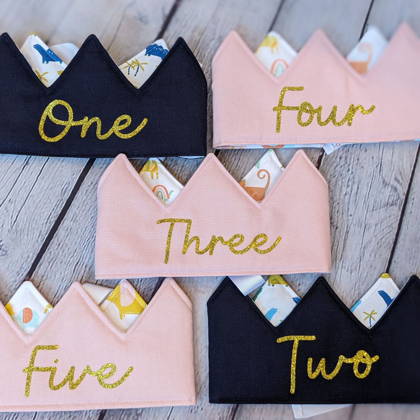 Numbered-Crowns-laid-flat-showing-numbers-glitter-gold-numbers-pink-navy